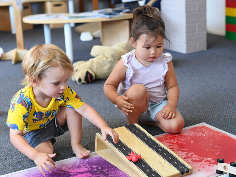 2 kids are playing inside the education kids centre