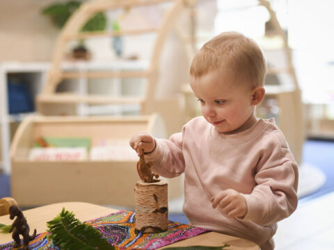 Child is playing with a toy