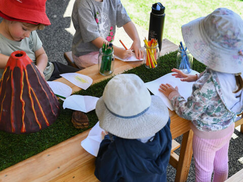 Kids are drawing in the draw session in the education centre